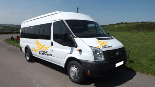 Liberal Democrat minibus sets off for Parliament with its 11 MPs